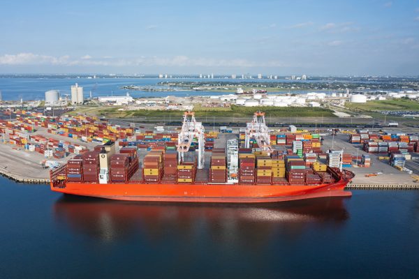Port Tampa Bay Container Terminal with a red container ship