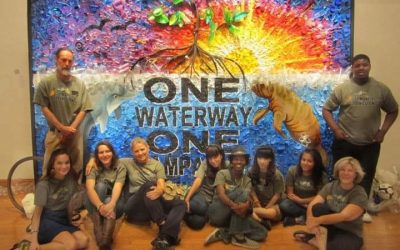 Port Tampa Bay hangs original artwork created from recyclable materials by local students in cruise terminal